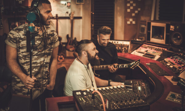 Professional music band recording song in boutique recording stu Professional music band recording song in boutique recording studio.